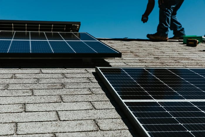 man installing solar power